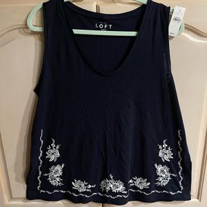 NWT sleeveless top in deep navy with a white embroidered design. Size L love it!